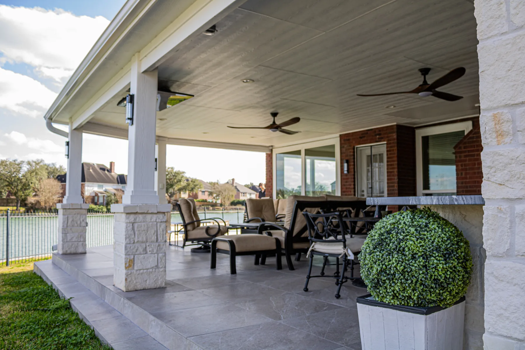 Lakefront patio cover and outdoor kitchen built by Colony Builders in Clear Lake