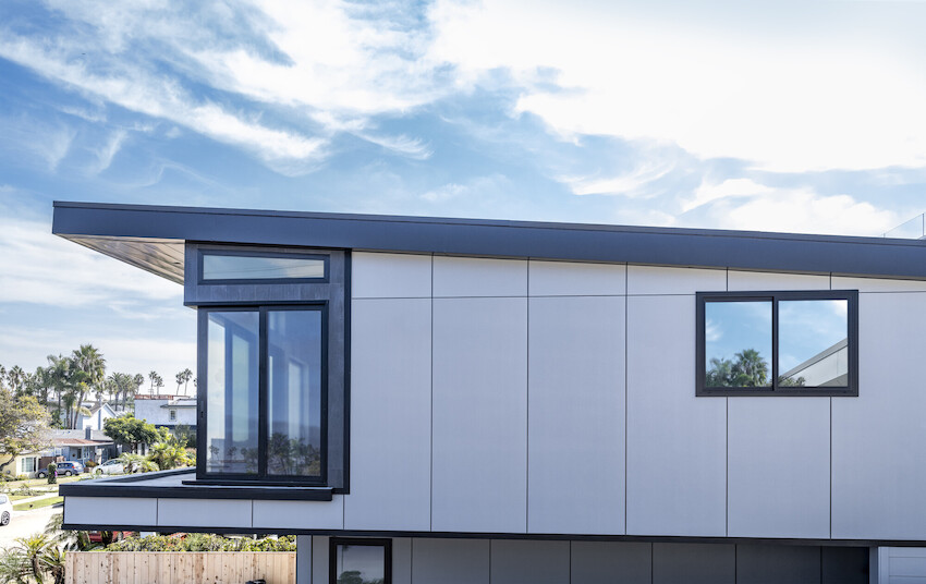 Contemporary California beach home combining white architectural panels with dark plank and Artisan square-channel siding details