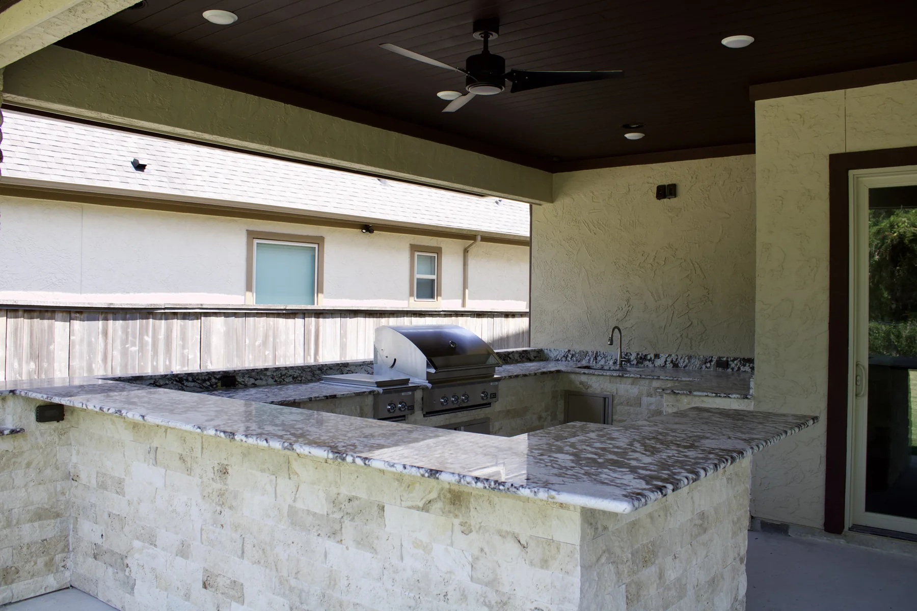 Covered outdoor kitchen area beneath the Katy patio addition