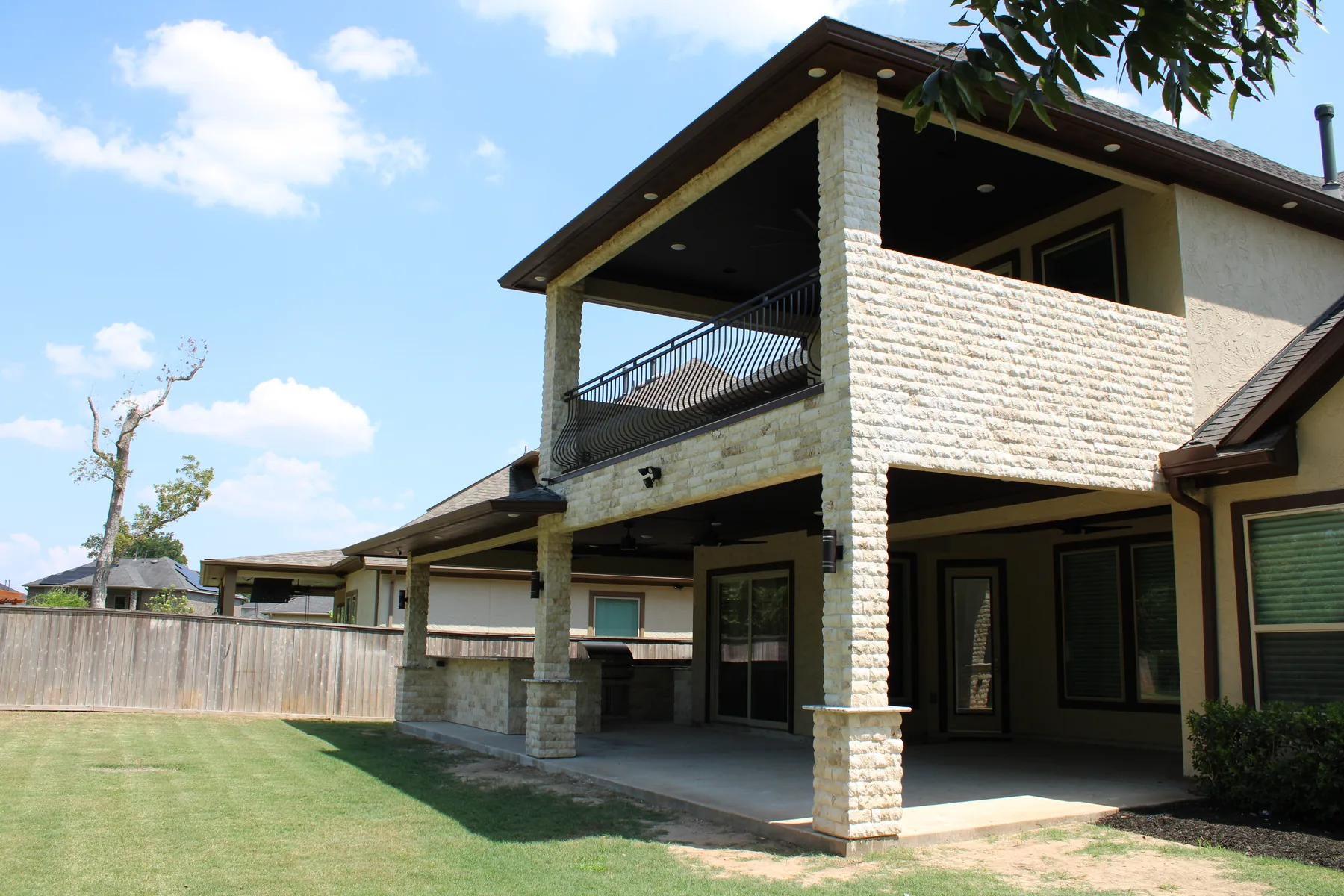 Full rear view of the two-story Katy outdoor-living project