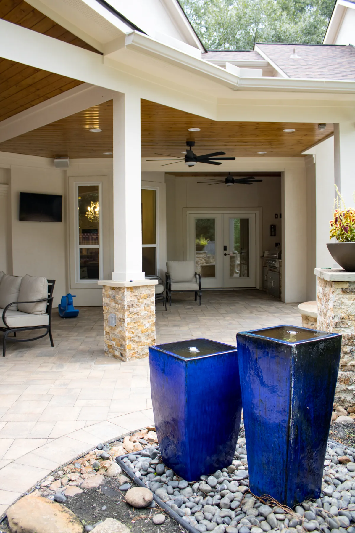 White patio-cover framing with integrated recessed lighting