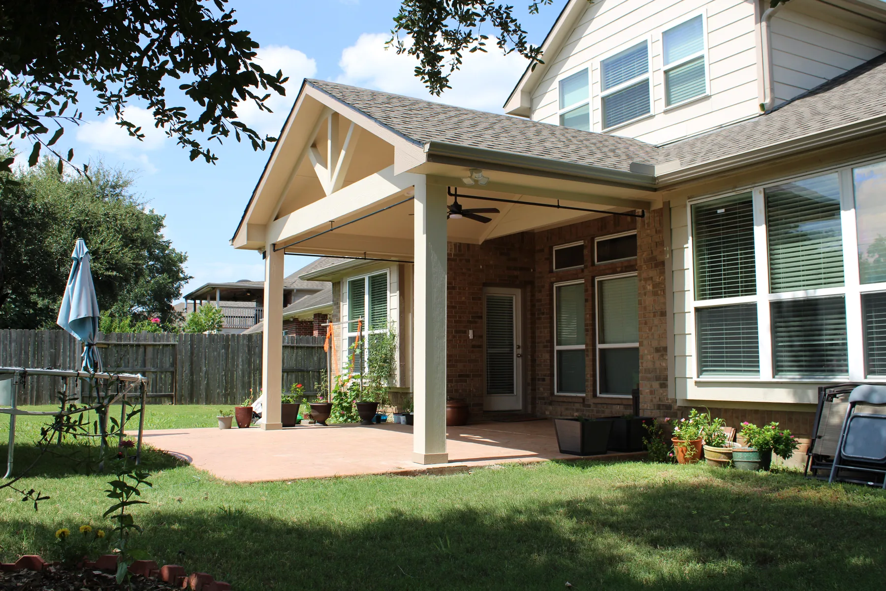Gable-roof patio cover built by Colony Builders at a Sugar Land home